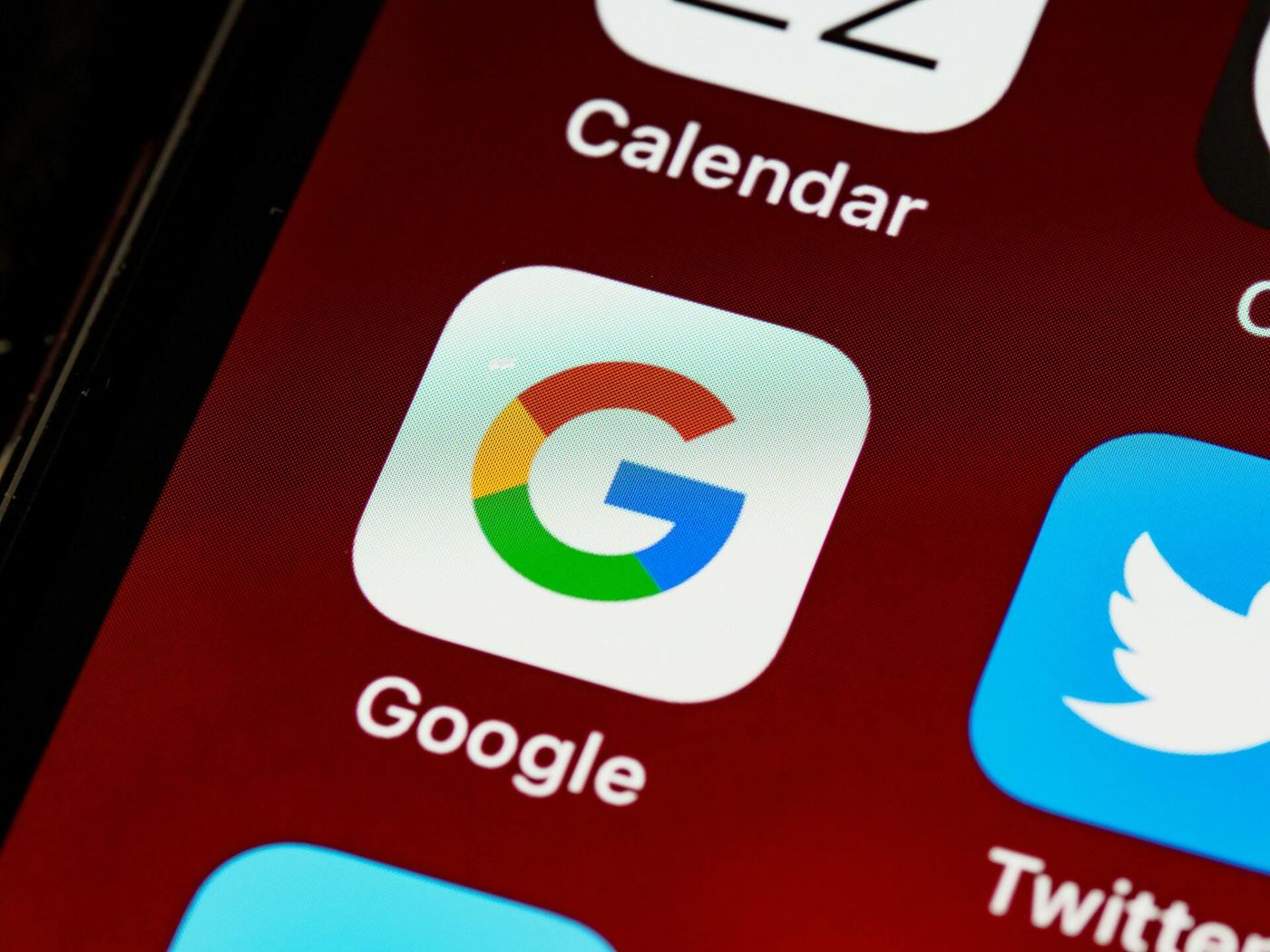 Close-up of a smartphone home screen with the Google app icon
